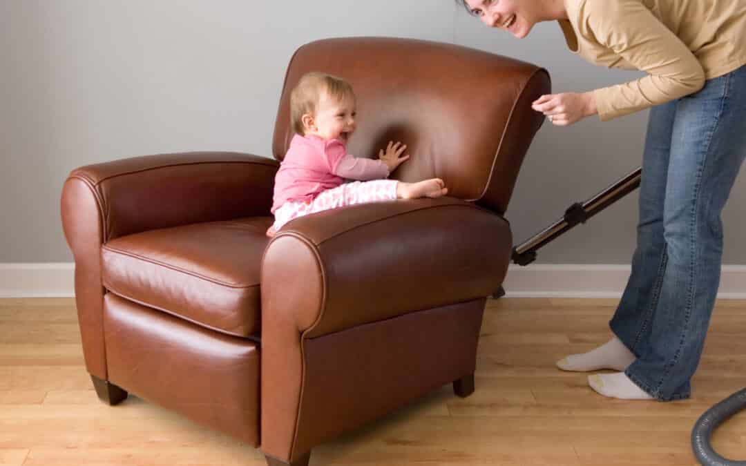 baby on a leather chair