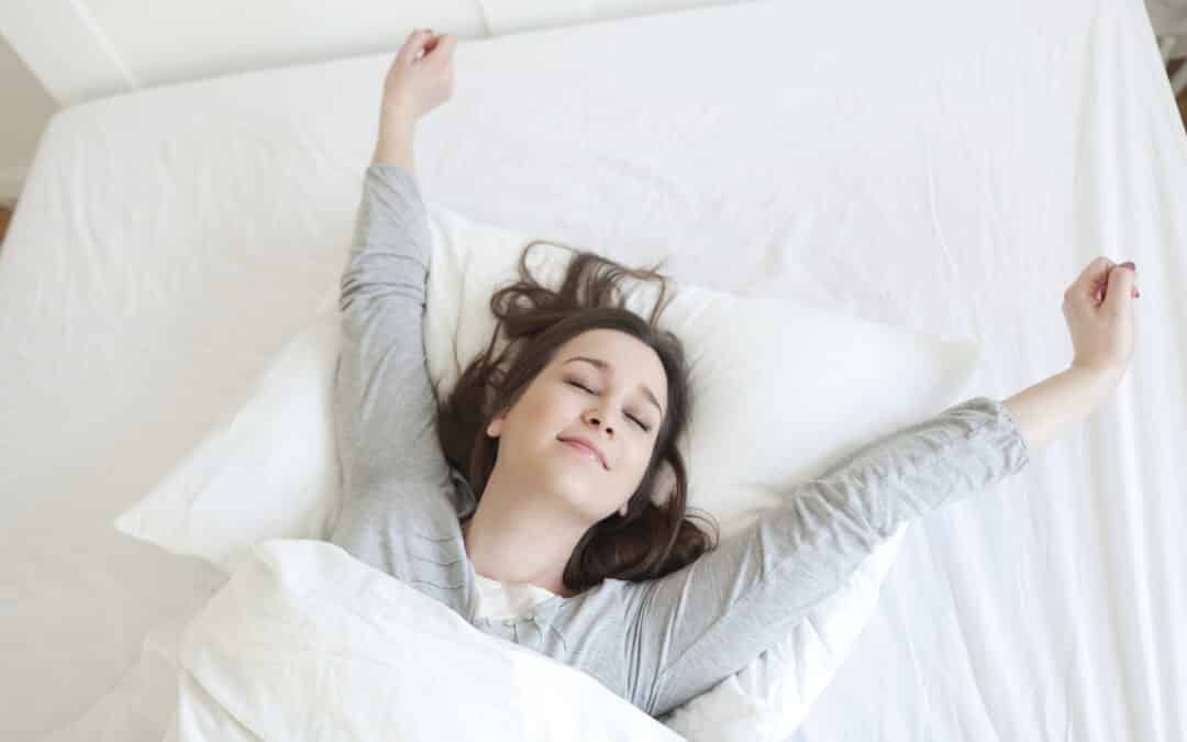 happy woman on bed